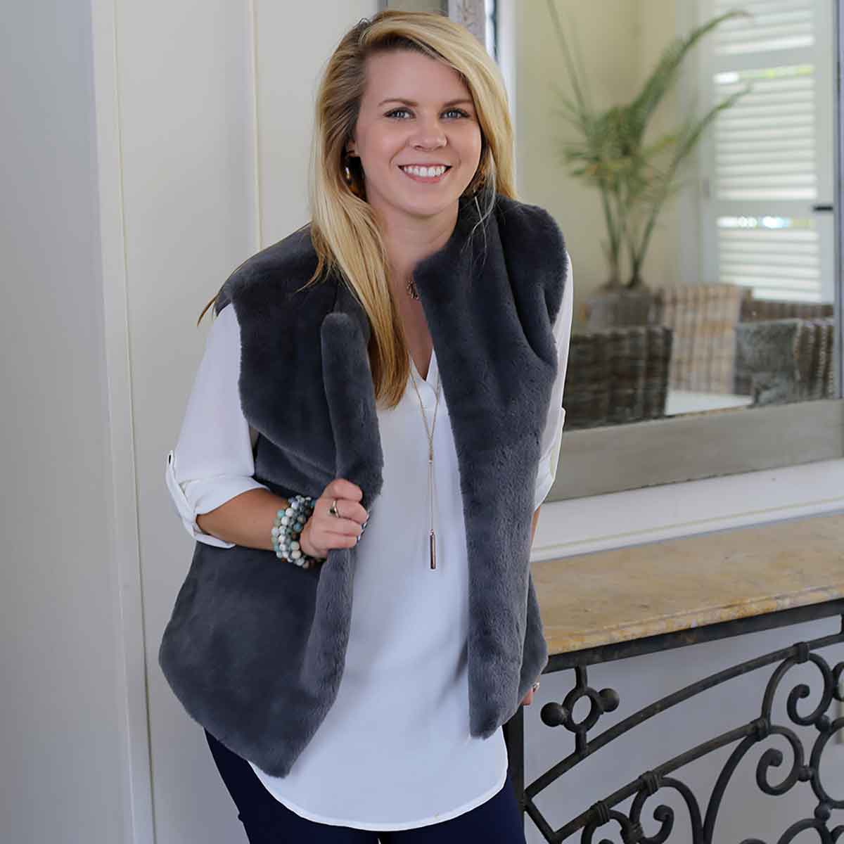 maroon fur vest